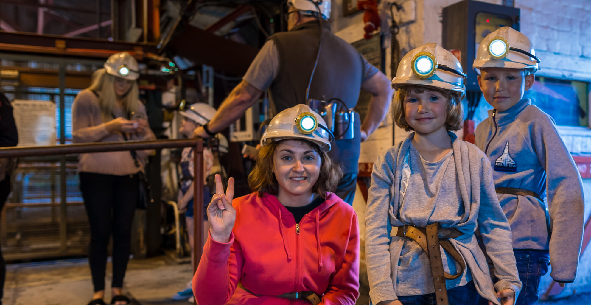 adult and two children visit abandoned coal mine