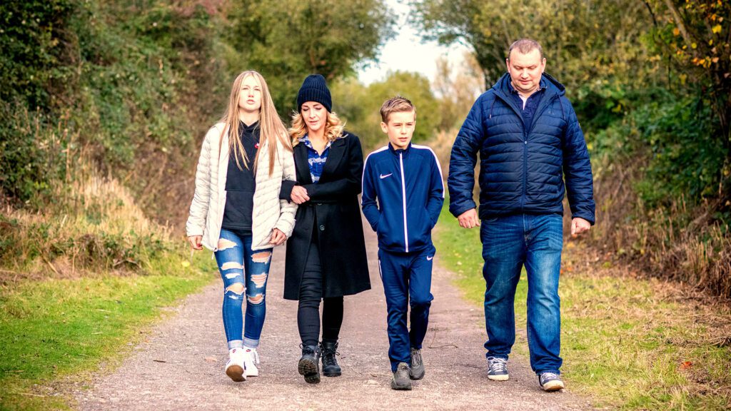 foster family walking down a path