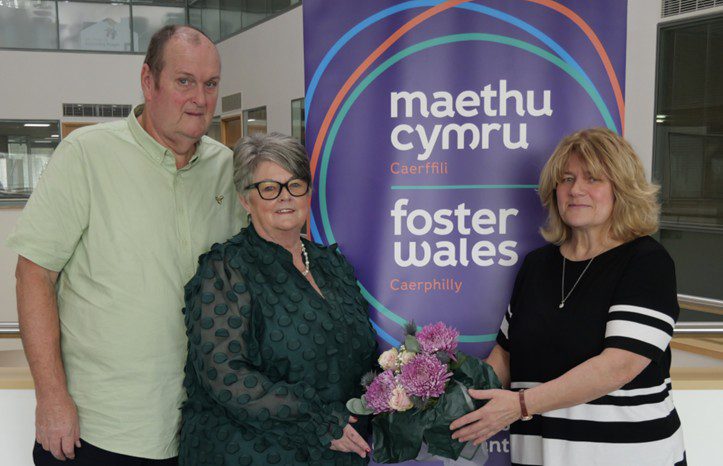 Foster carers deb and ian receiving flowers